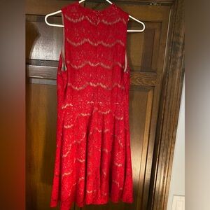 Red lace dress with nude underlay, sleeveless, mid neck collar
